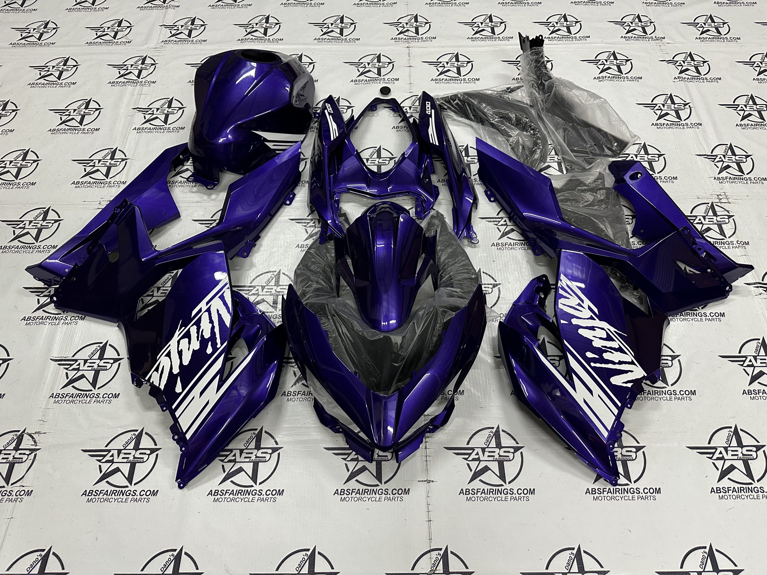 With the Pearl Purple Ninja 400 firing kit, can the white decals be changed to a burnt orange colour at all?